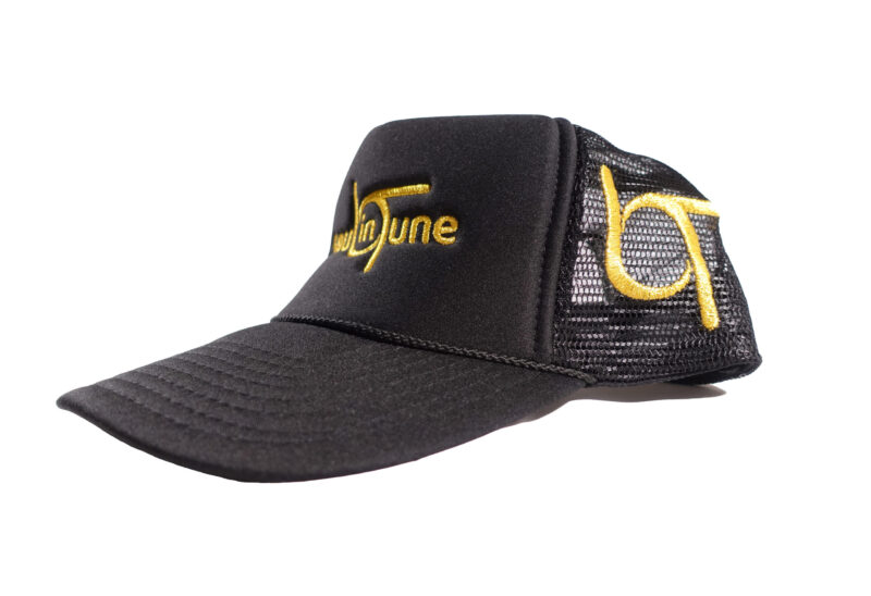 A black hat with yellow lettering and an ear.