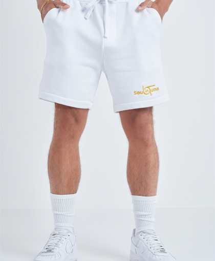 A man wearing white shorts and socks.