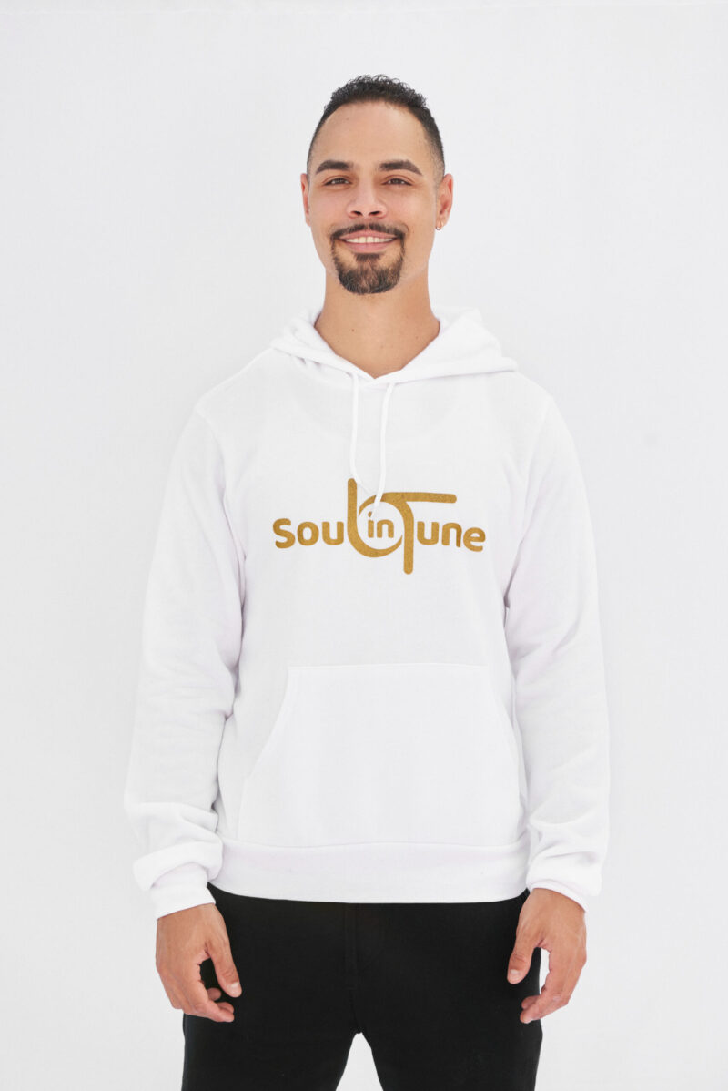 A man wearing a white hoodie with the word soul in tune.