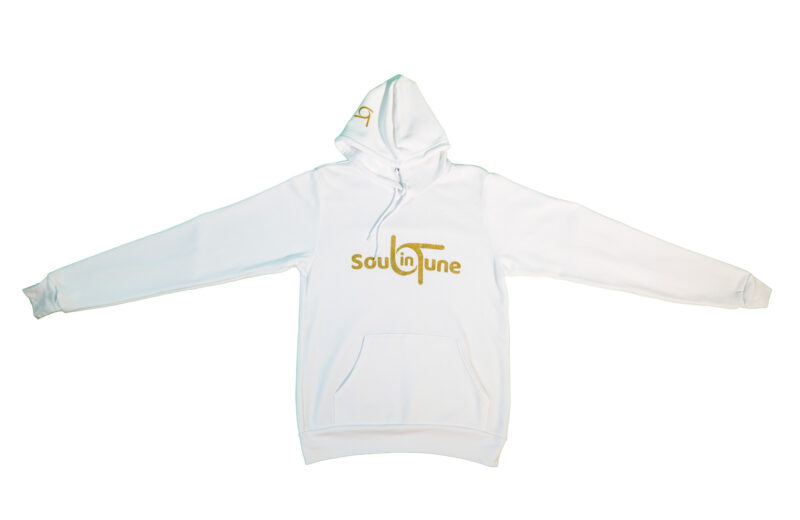 A white hoodie with gold lettering and the word " soulfire ".